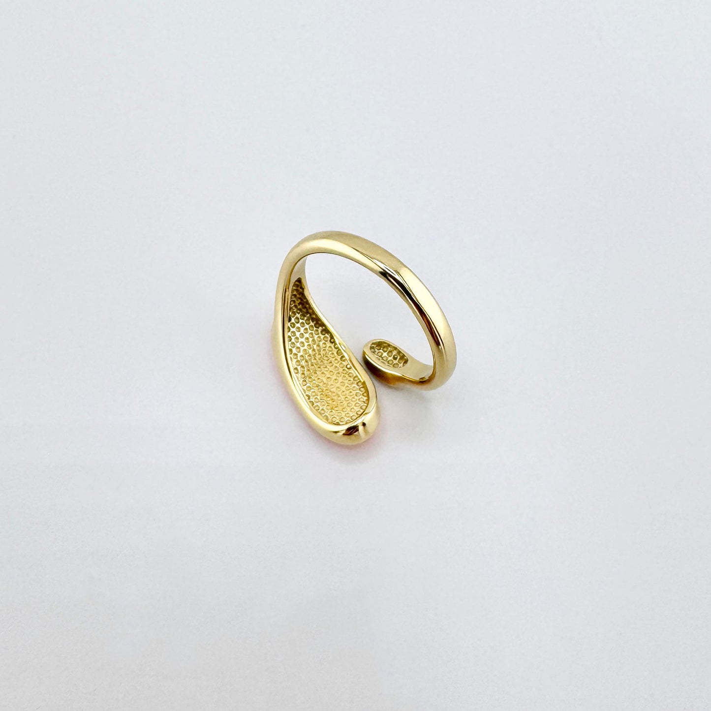 Gold-plated stainless steel ring with an asymmetrical design and orange enamel, French brand Ikita.