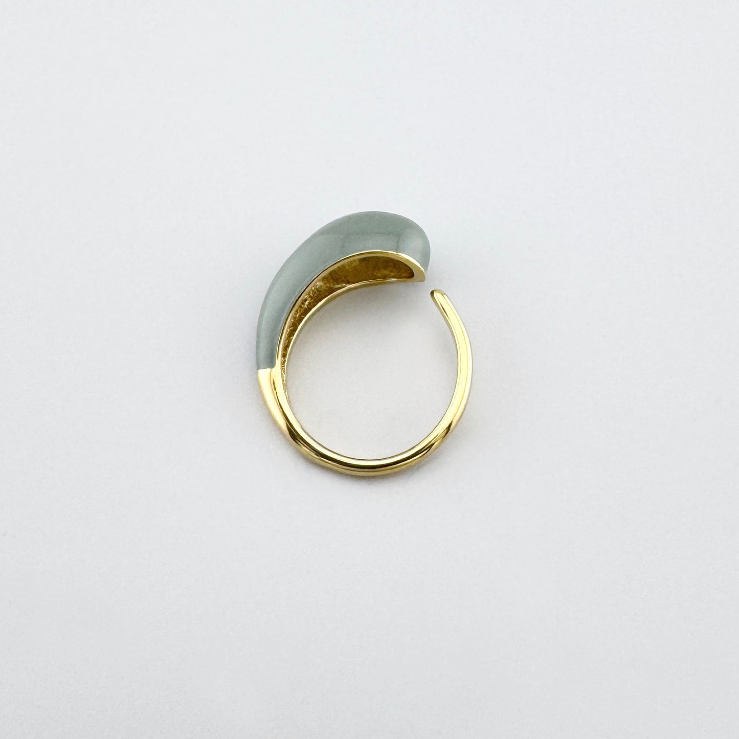 Open ring made of gold-plated stainless steel with a gray, convex ornament, modern design, French brand Ikita.