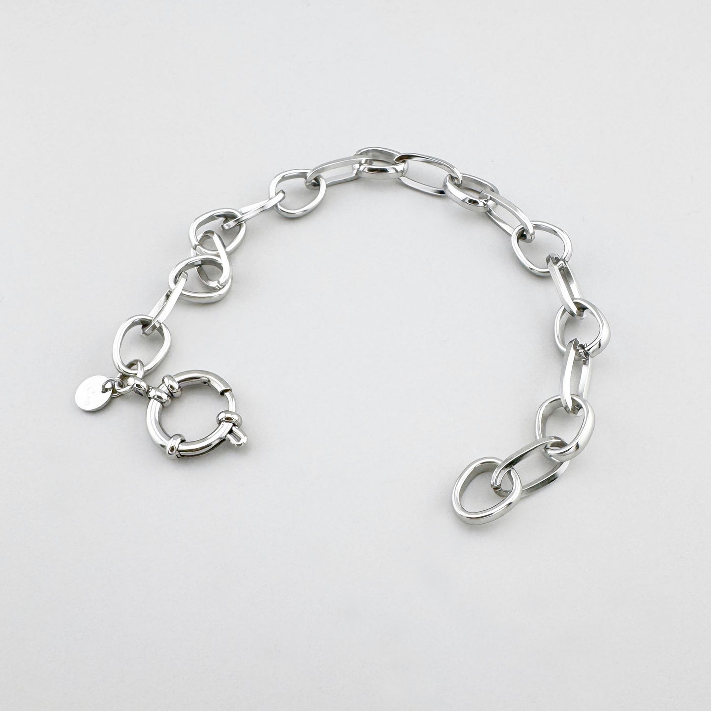 Браслет из нержавеющей стали с оригинальными звеньями и круглой застёжкой, французский бренд Ikita.