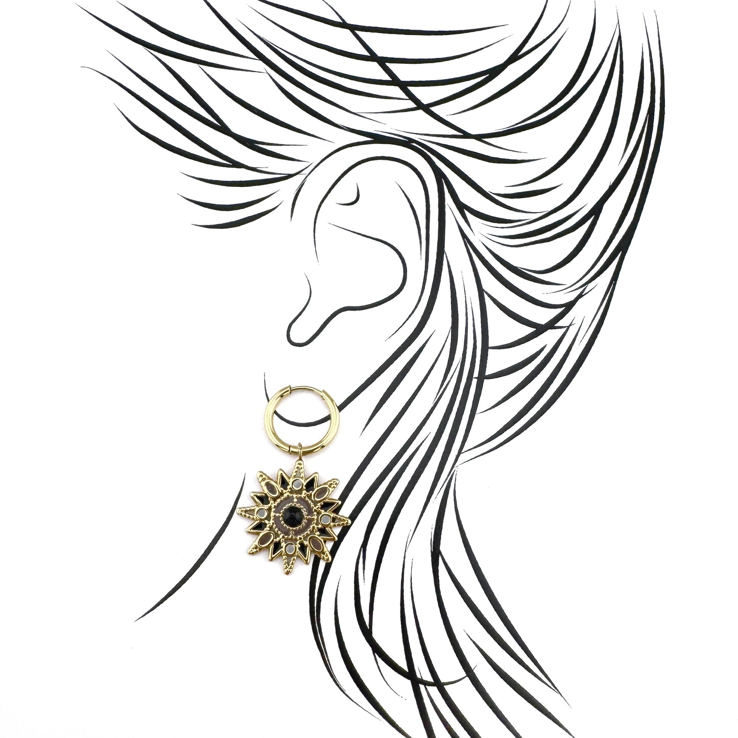 Gold star-shaped earrings with a black stone and enameled details, French brand Ikita.