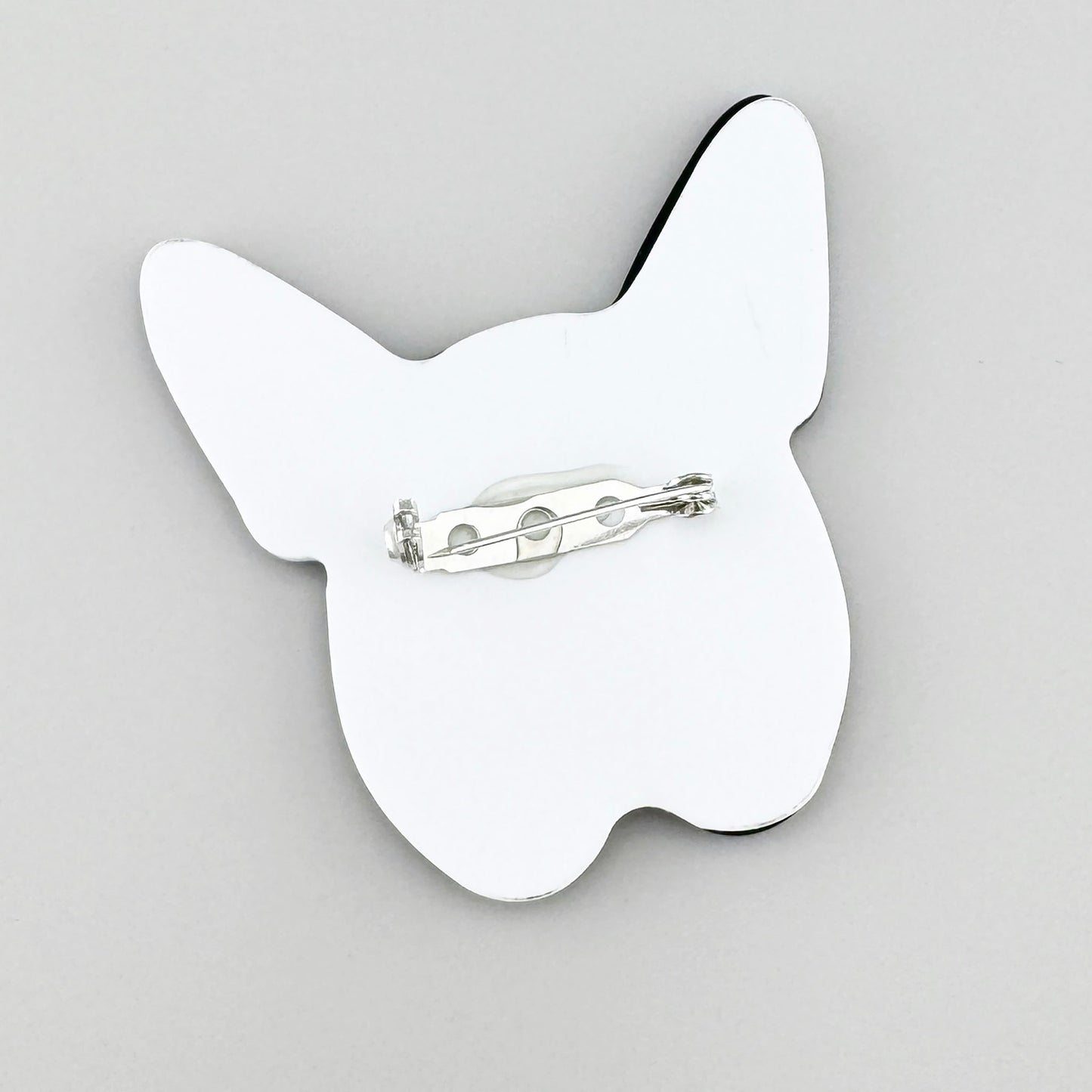 Brooch shaped like a bulldog head in black and white colors, Spanish brand Sonata.