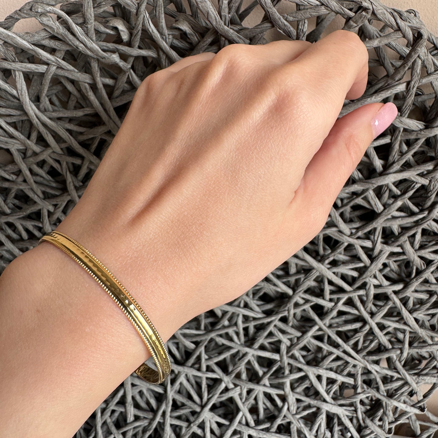 Minimalist gold bracelet with delicate engraved edges, French brand IRL.