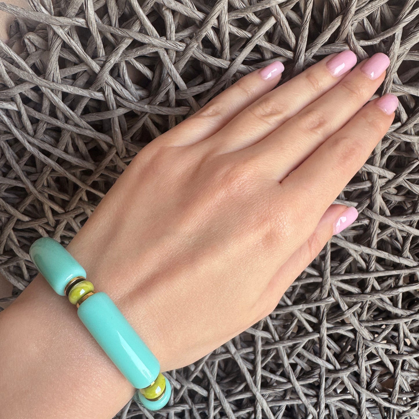 Elastic bracelet with turquoise and light green glossy beads, French brand Ikita.