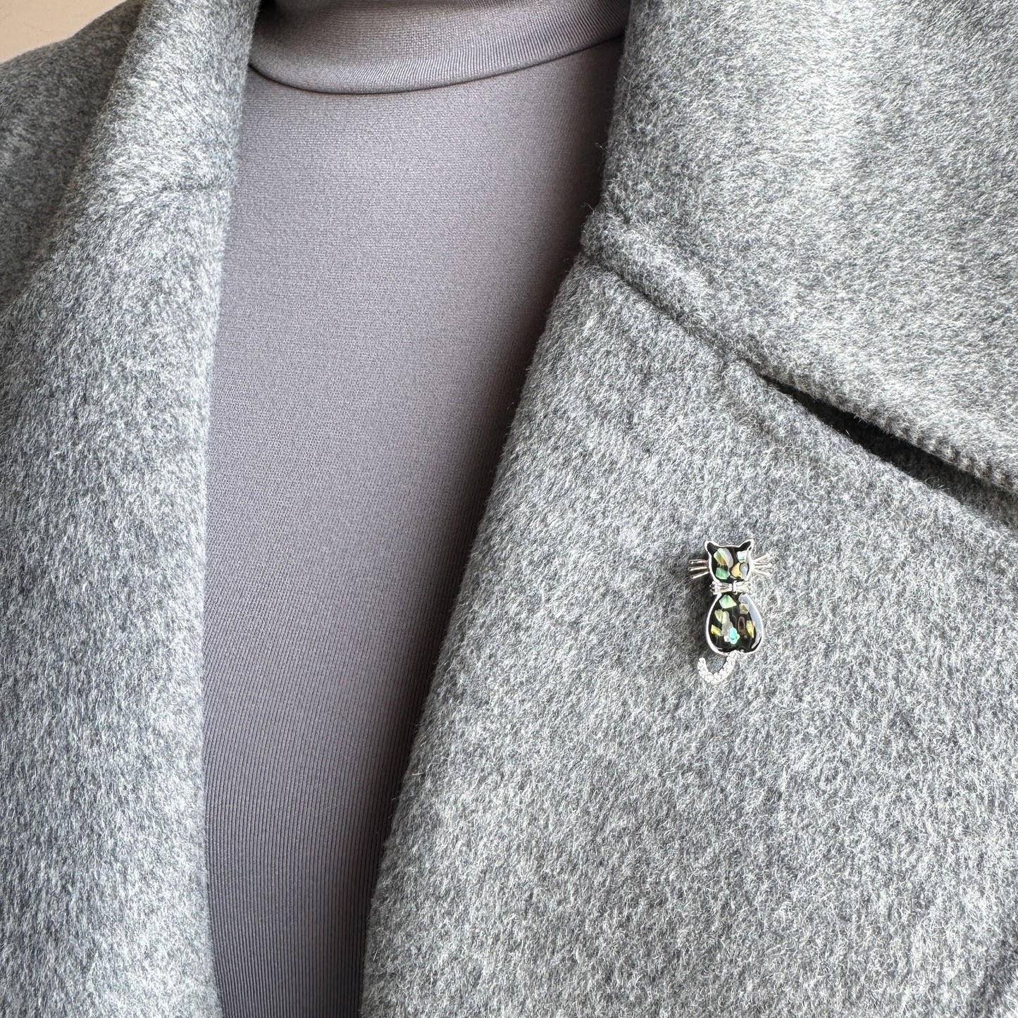 Cat-shaped brooch with mother-of-pearl accents and rhinestones, Spanish brand Maravillas.