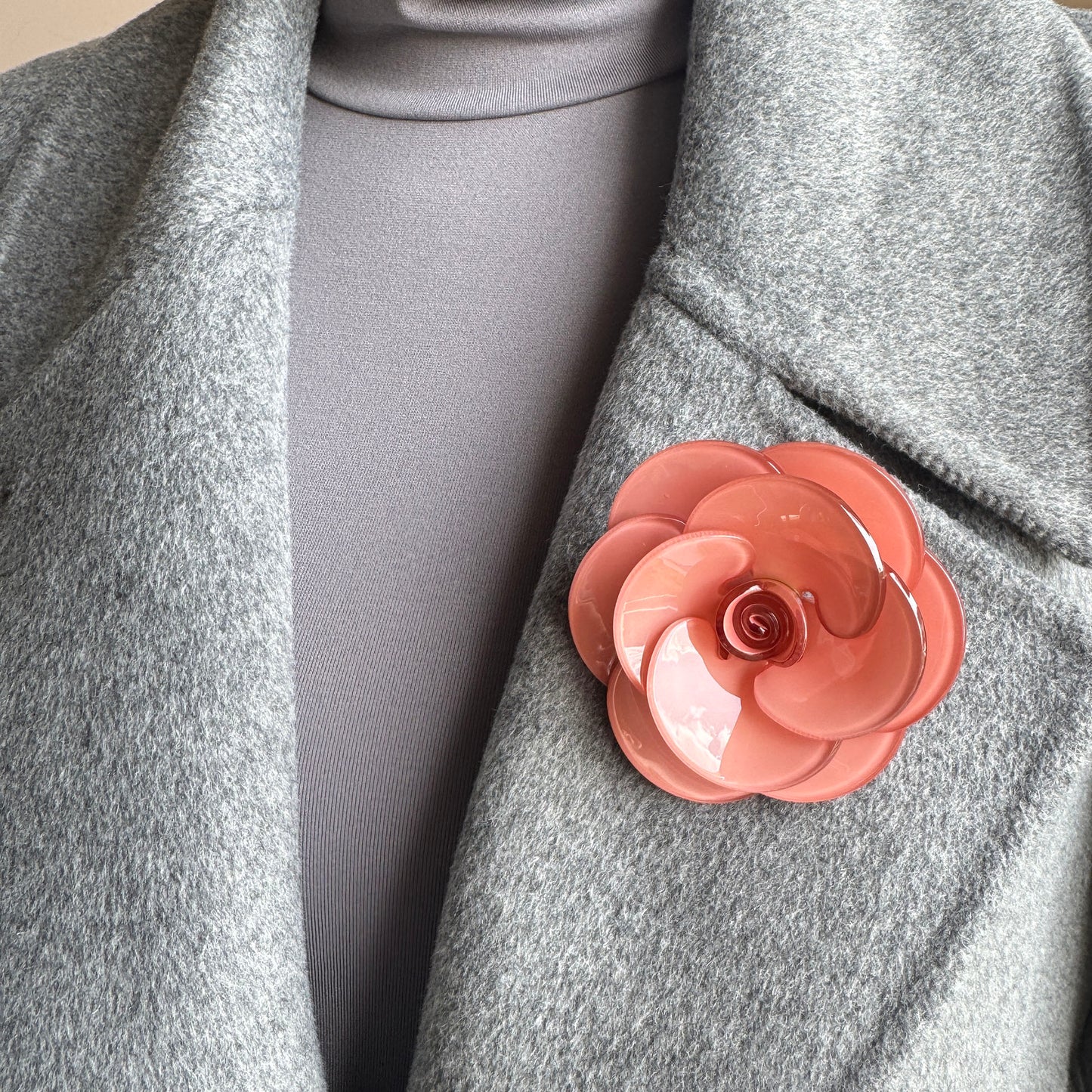 Rose-shaped brooch made of glossy peach acrylic, Spanish brand Sonata.