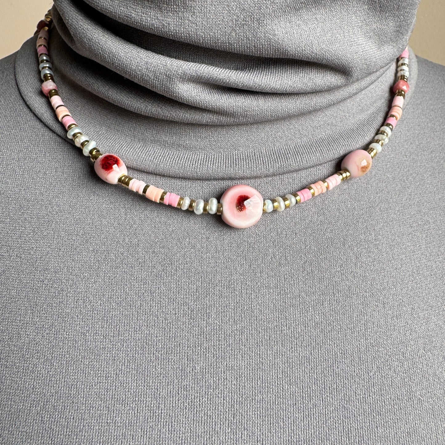 Necklace with ceramic beads in soft pink and beige tones, French brand Ikita.