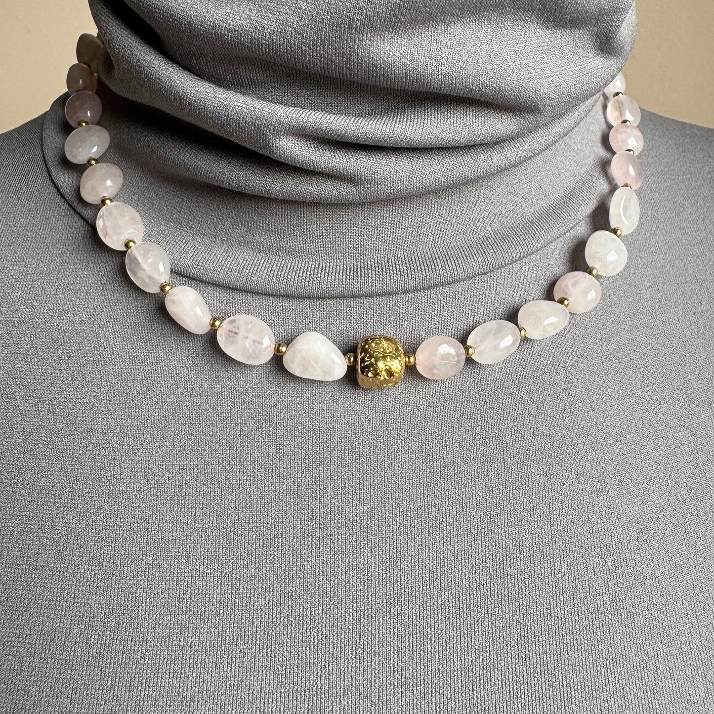 Necklace made of natural rose quartz with a gold accent bead, French brand Ikita.