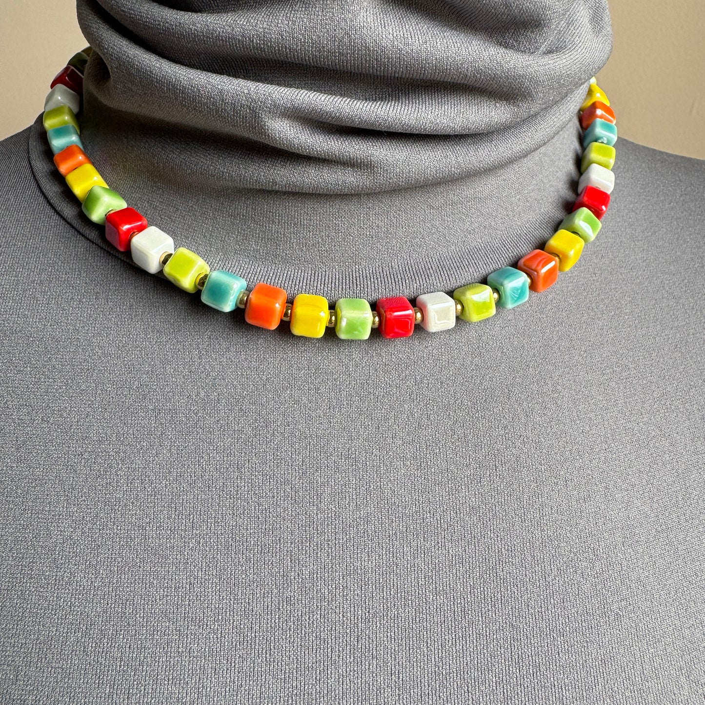Necklace with glossy multicolor ceramic cubes, French brand Ikita.