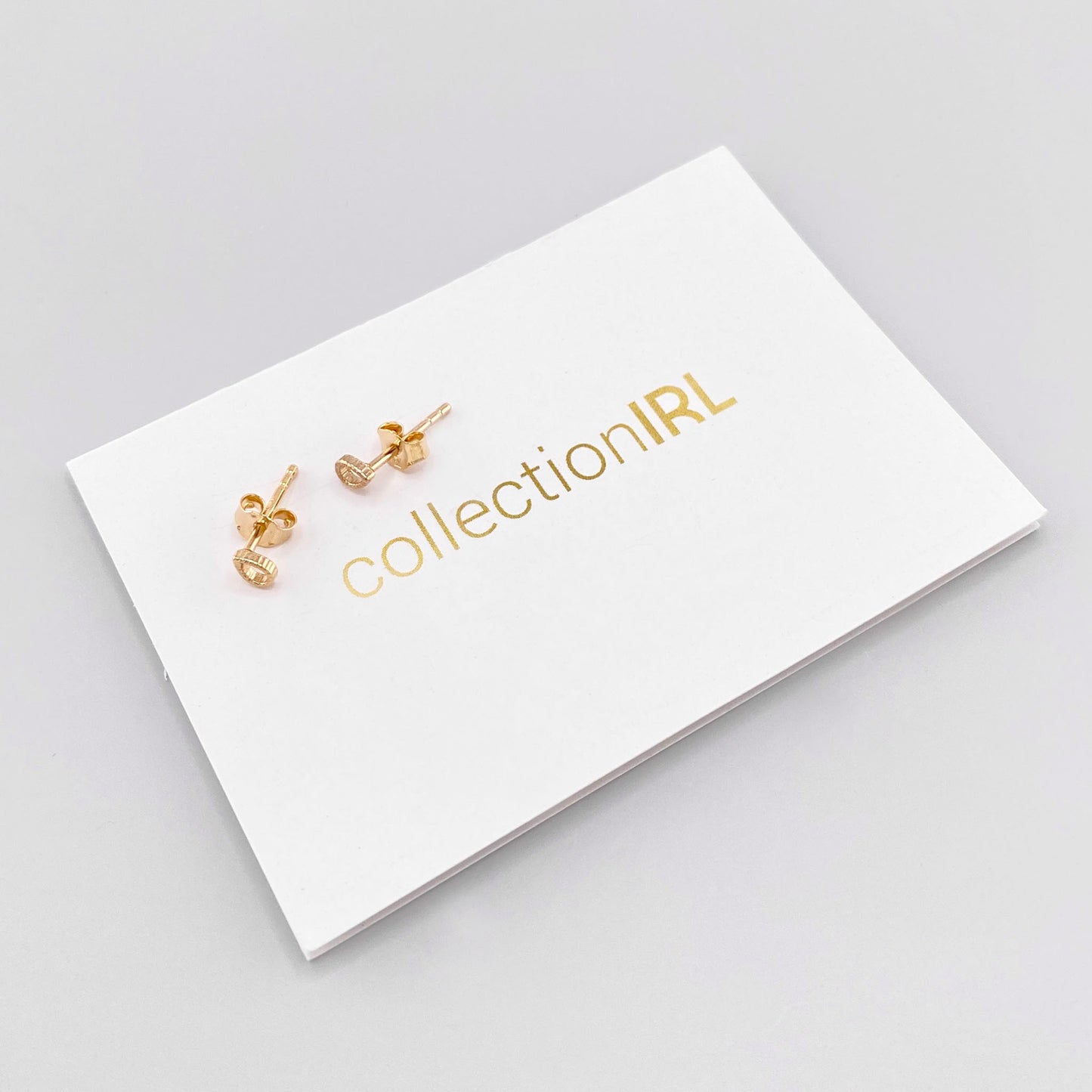 Gold-plated stainless steel earrings in a minimalist style, French brand IRL.