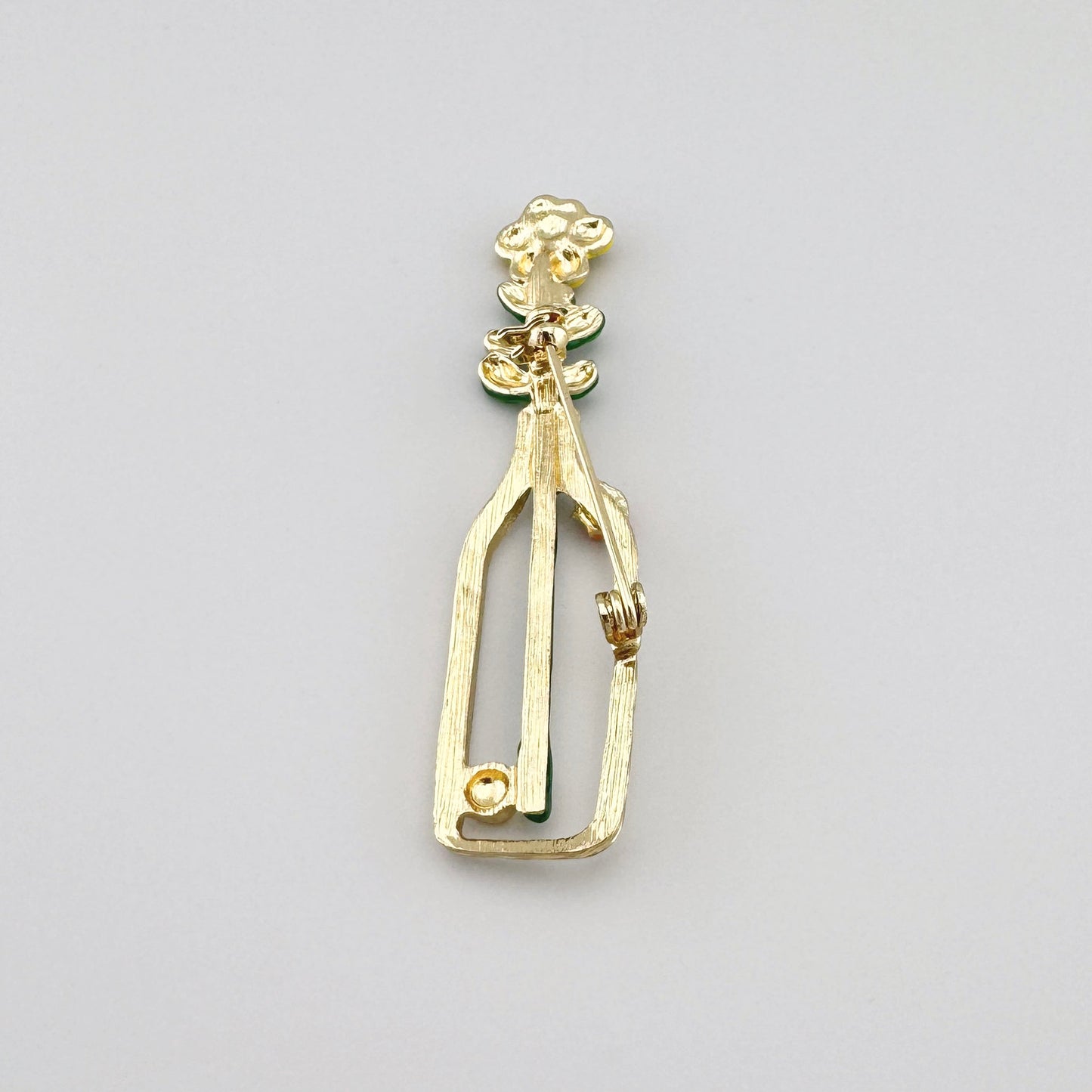 Брошка Sonata у формі пляшечки з квіткою та делікатною застібкою ззаду