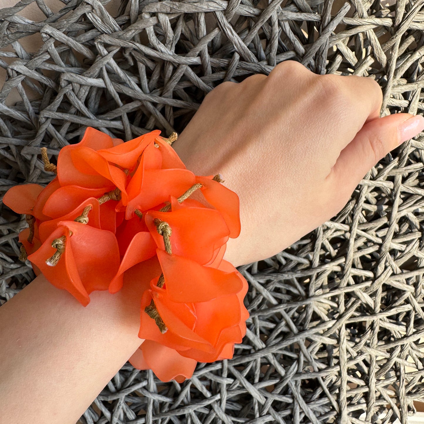 Coral flower petal bracelet on hand with elastic band