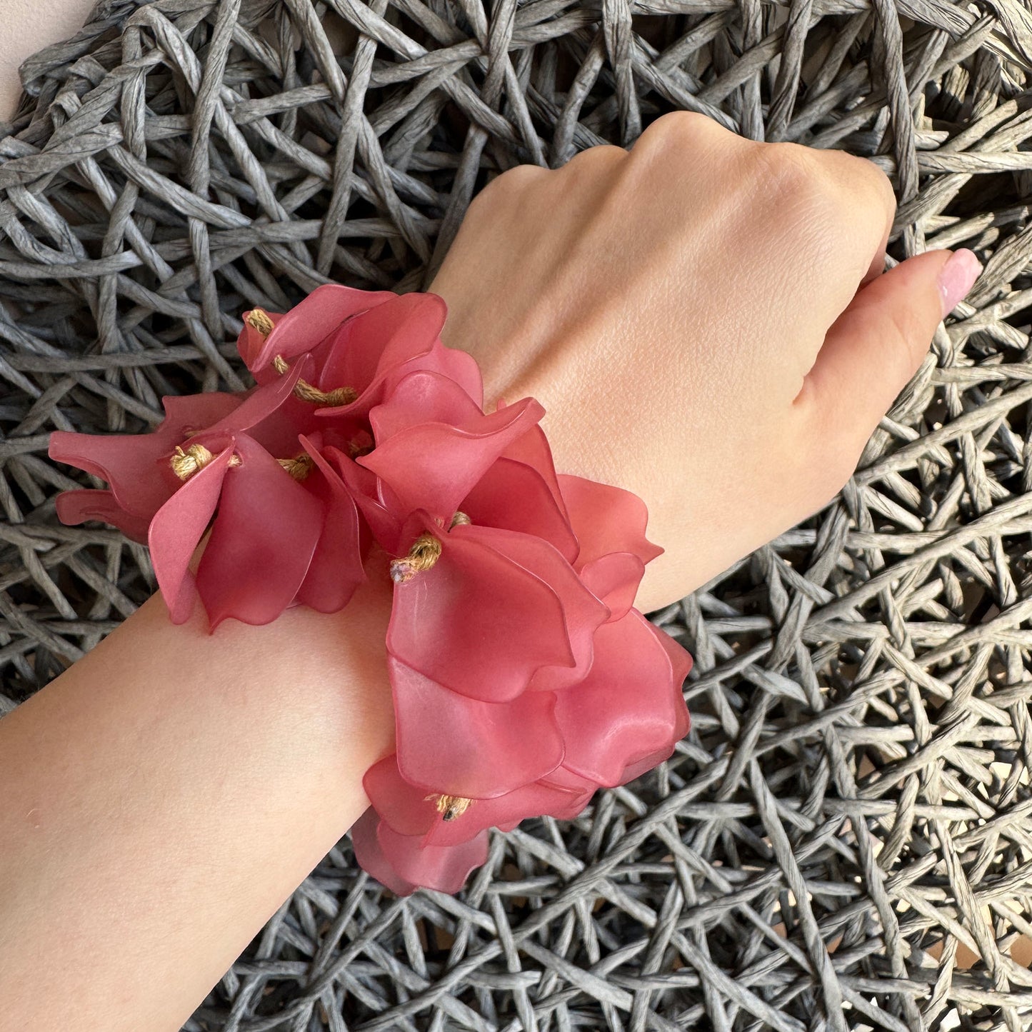 Pink petal bracelet worn on wrist with romantic summer look