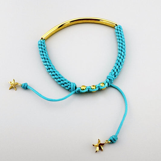Turquoise braided bracelet Thomas Sabo with an adjustable cord and gold-tone center bar
