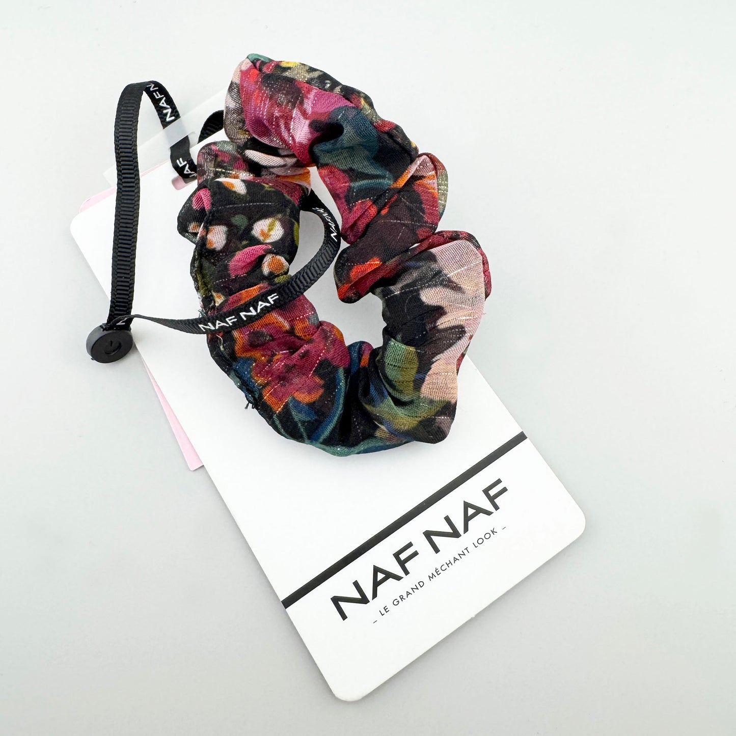 Colorful floral hair tie Naf Naf with a black ribbon and soft sheen
