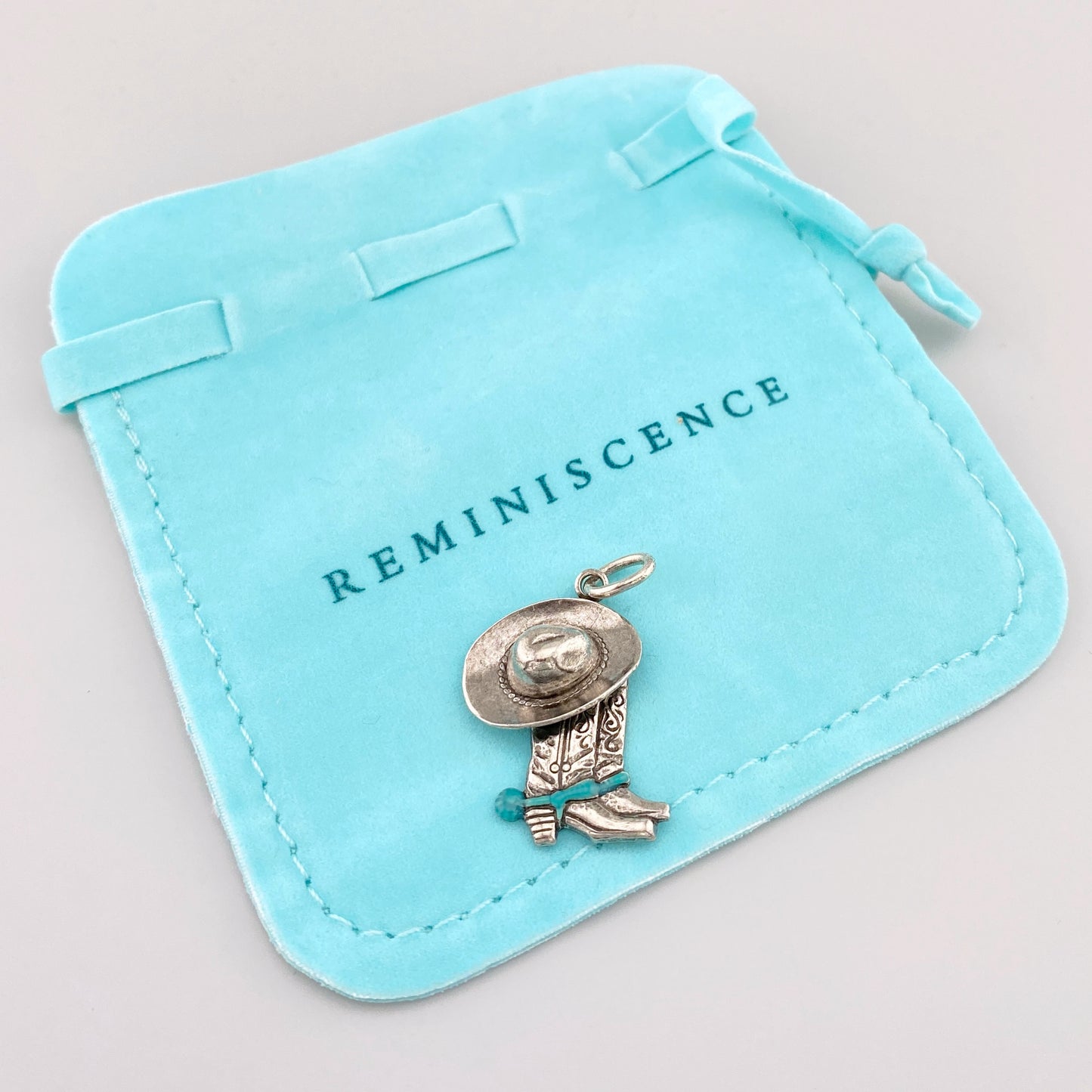Reminiscence charm shaped like cowboy boots and hat with western-style details