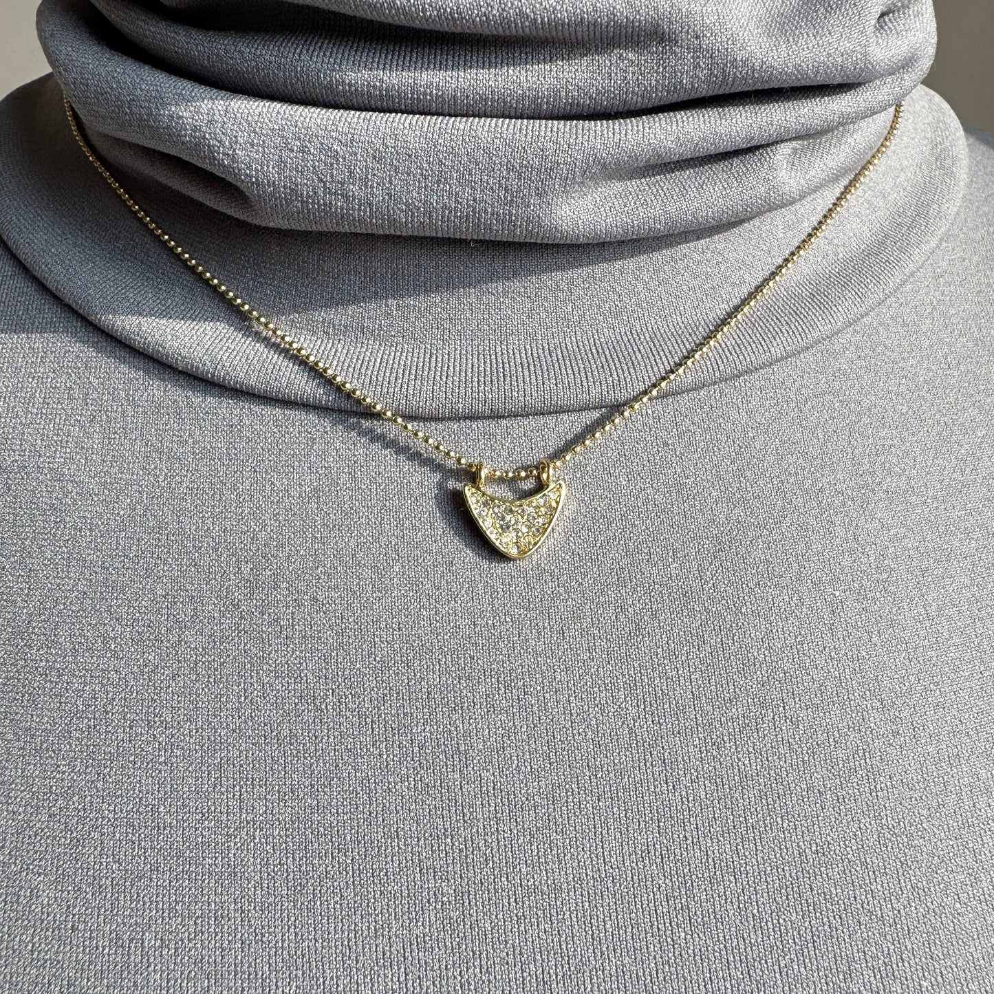 Elegant Pilgrim necklace with small zirconia pendant on fine gold-plated chain