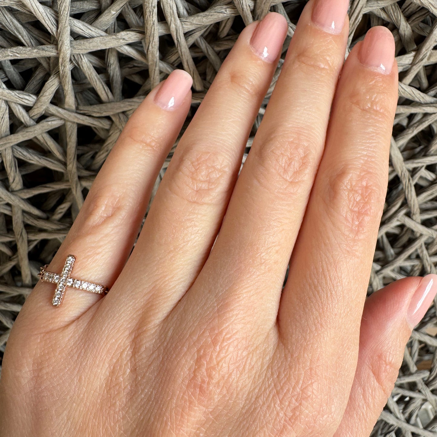 Elegant Reminiscence cross ring with rose gold plating and sparkling cubic zirconia