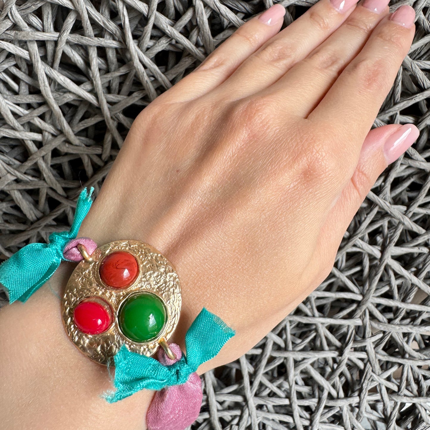 Sonata fabric bracelet with colorful cabochons and gold-tone base worn on wrist