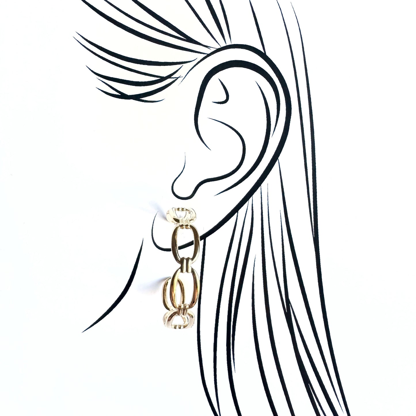 Gold IRL chain hoop earrings with linked rings worn on illustrated ear