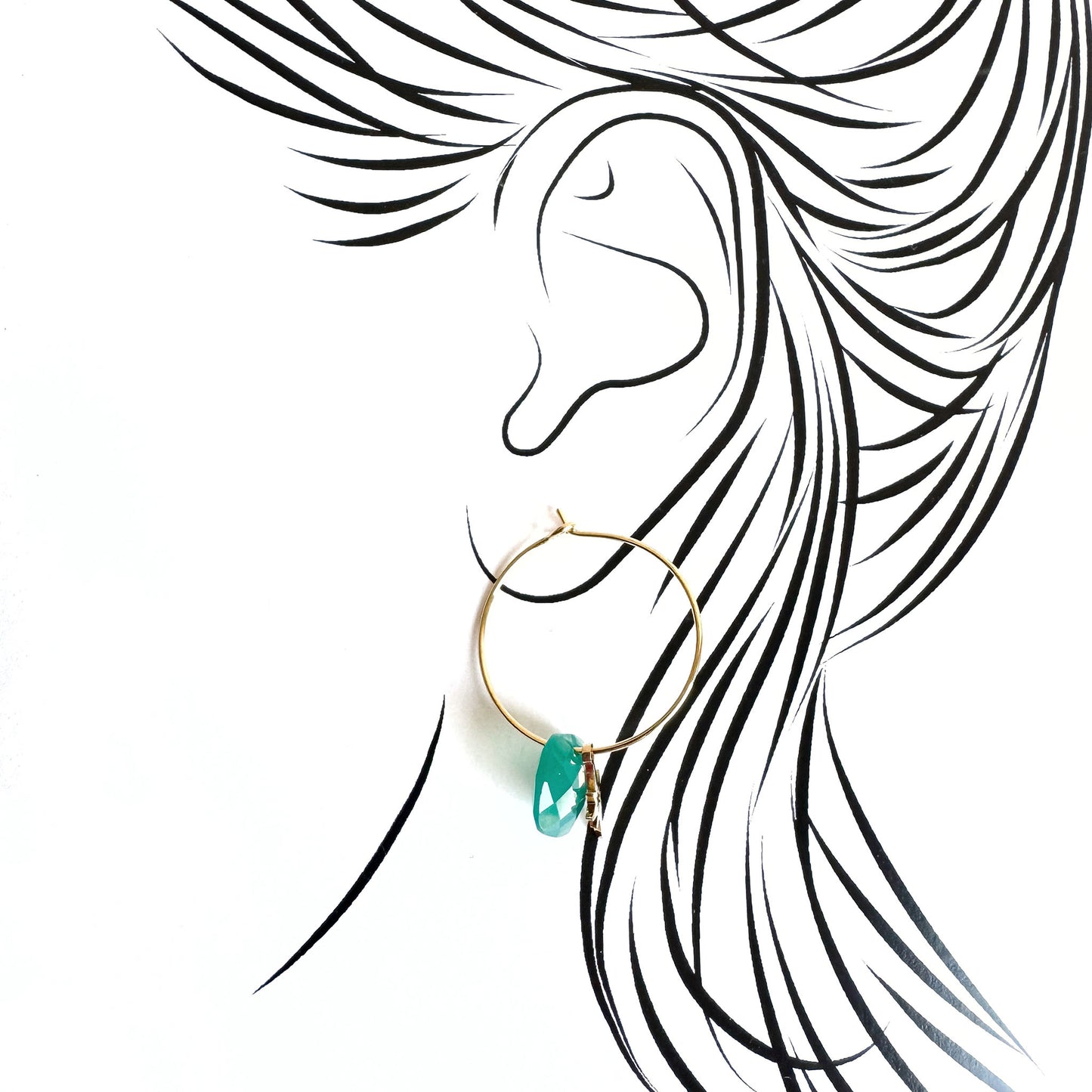 Gold IRL hoop earrings with natural green stone and star charm worn on illustrated ear
