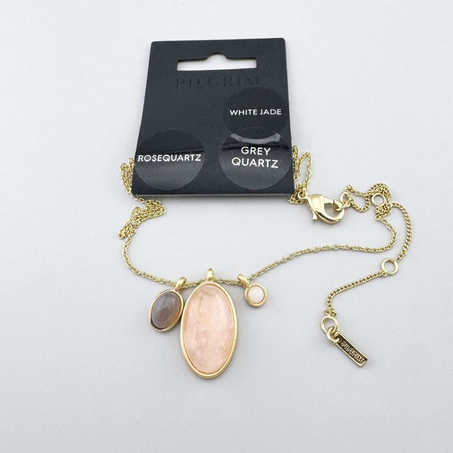 Pilgrim Halskette mit Rosenquarz, Jadeit und grauem Quarz im goldfarbenen Design