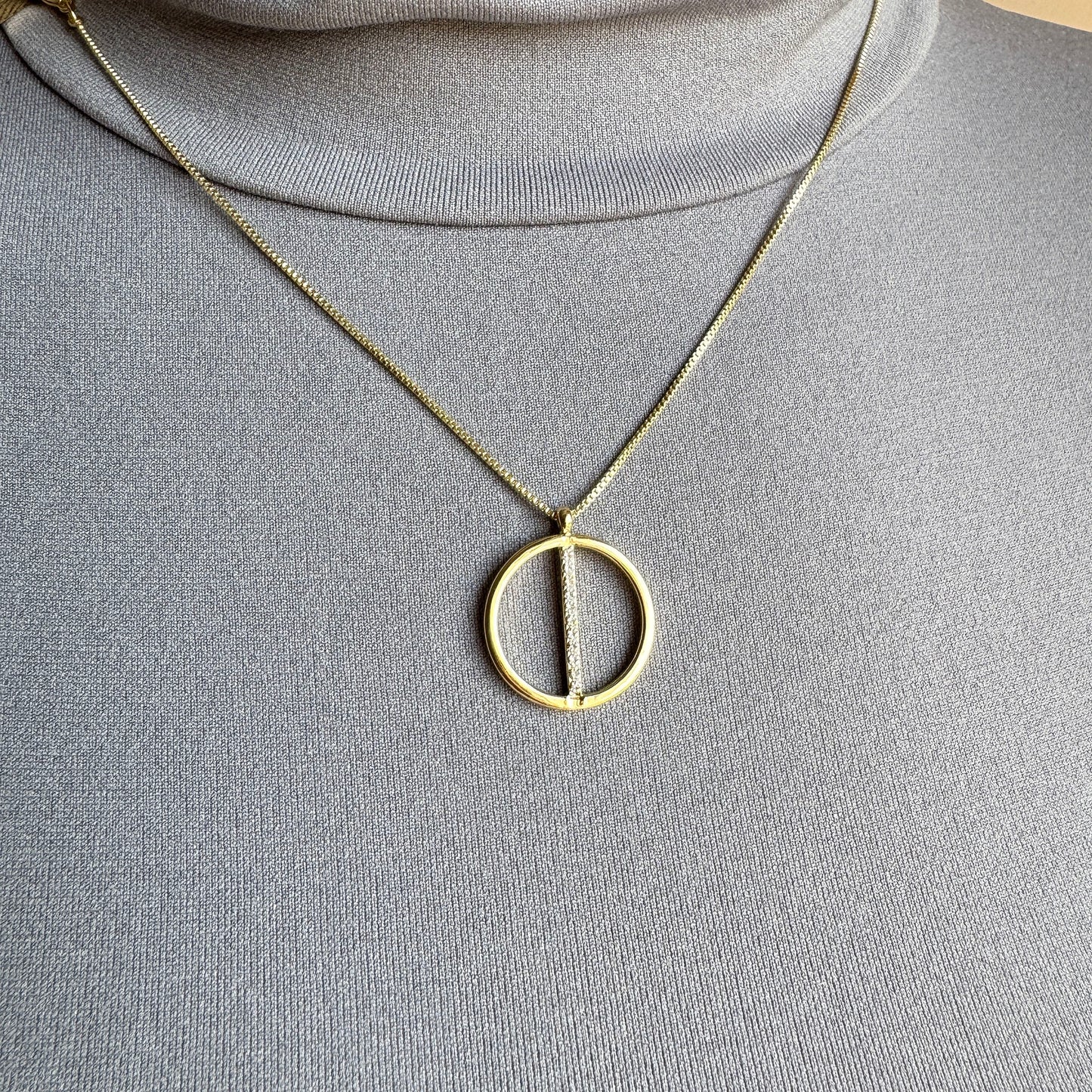 Gold Pilgrim necklace with geometric circle pendant and zircons worn on neck
