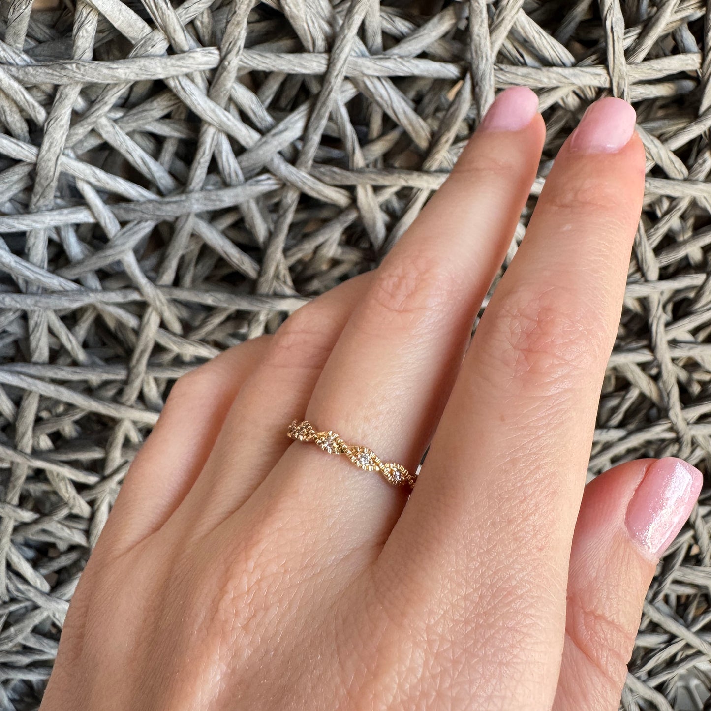 Gold-plated ring with intricate pattern and sparkling zirconia stones