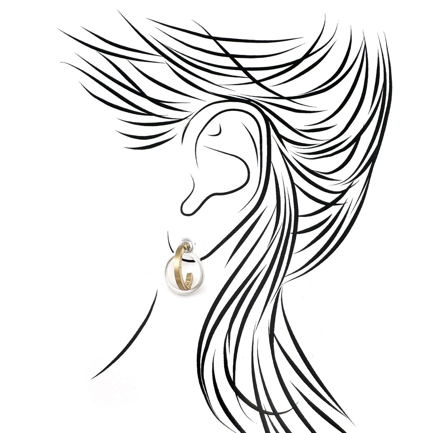 Dual-tone hoop earrings in silver and gold styled on sketch ear