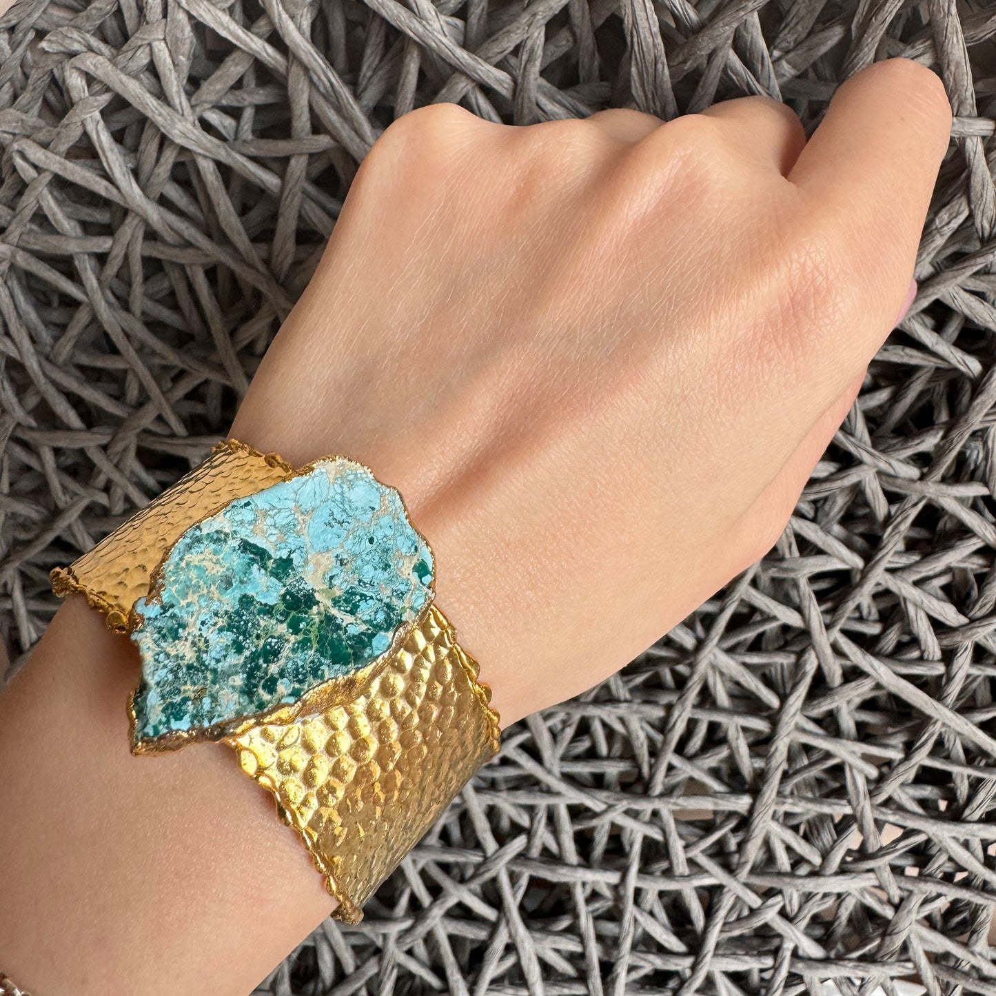 Gold-plated cuff bracelet with raw turquoise stone and textured finish