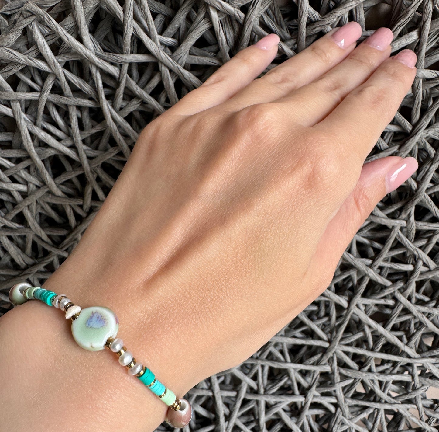 Handmade beaded bracelet with glazed ceramic and pastel accents