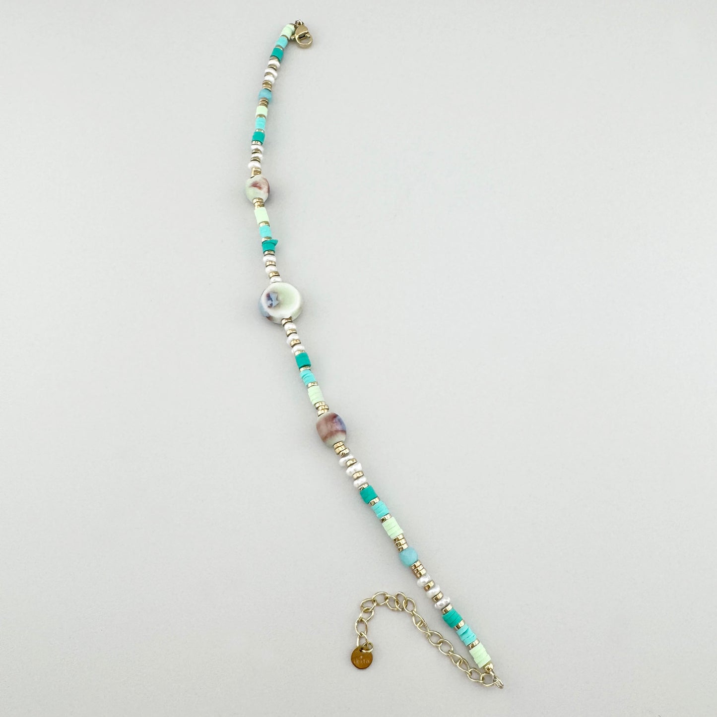 Delicate ankle bracelet with mint ceramic and shell beads in soft hues