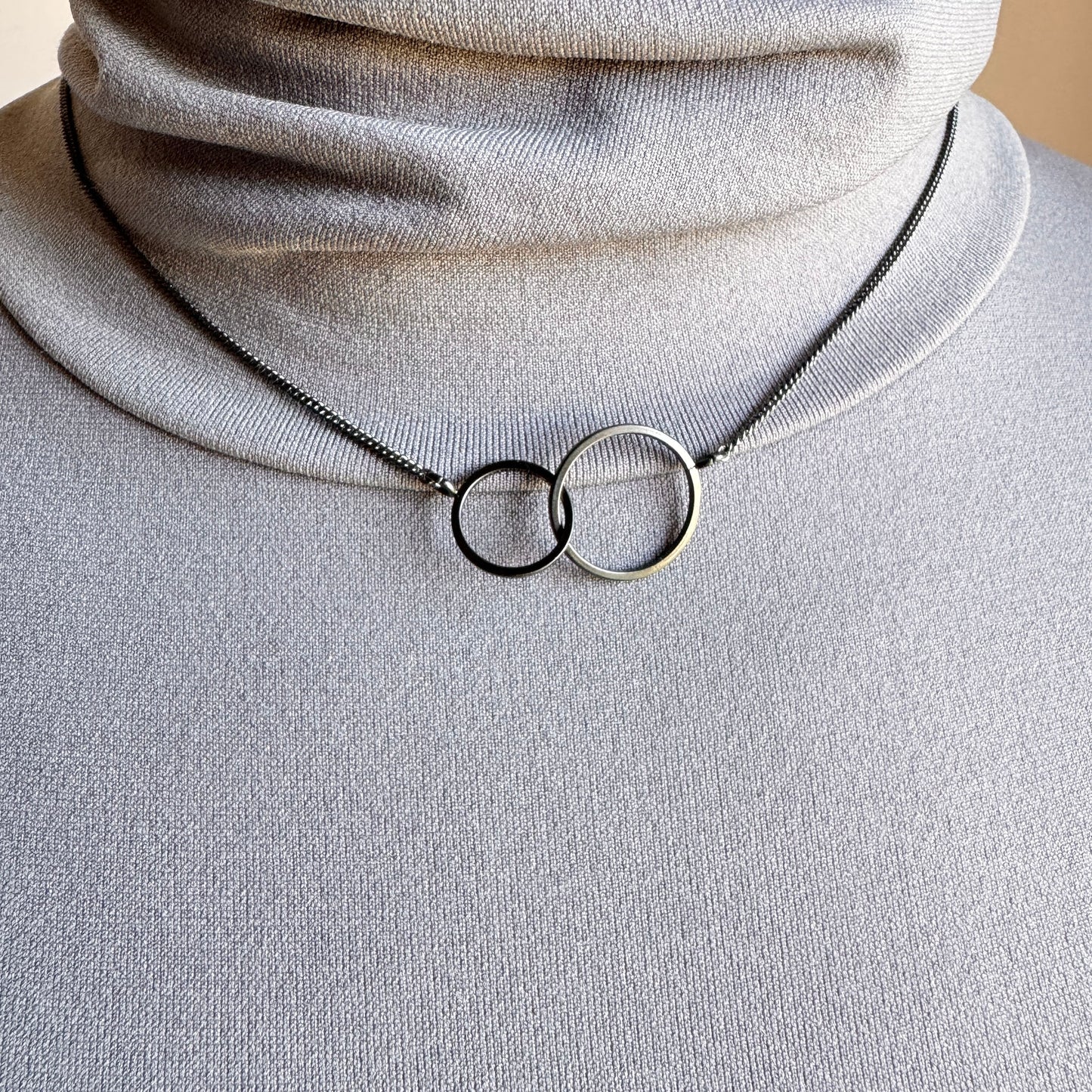 Elegant double circle necklace with rhodium finish and minimalist style