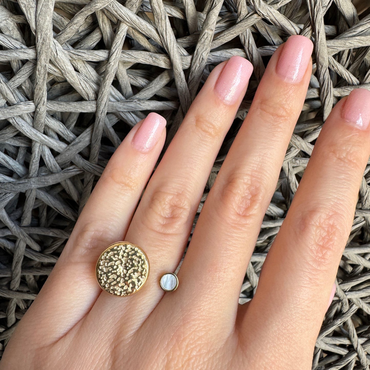 Gold-plated IRL open ring with hammered detail and mother of pearl accent worn on hand