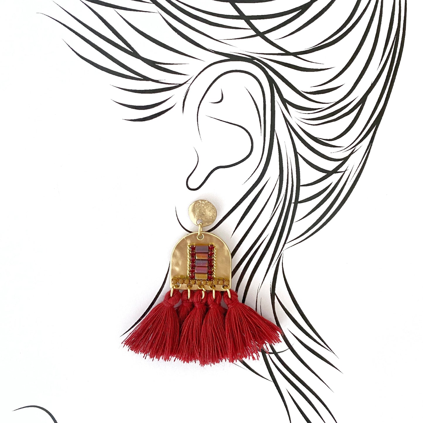 Ethnic-style earrings with red tassels and gold-tone studs