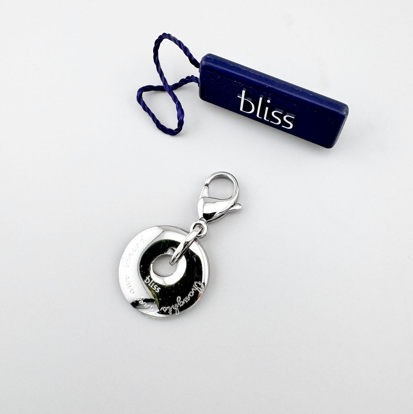 Okrągła zawieszka Bliss Gioielli z centralnym otworem i karabińczykiem ze stali