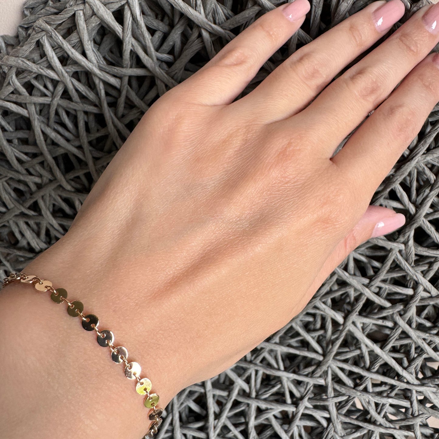 Delicate gold bracelet with reflective discs for daily elegance