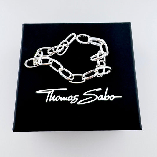 Chunky sterling silver link bracelet Thomas Sabo displayed on a black branded box