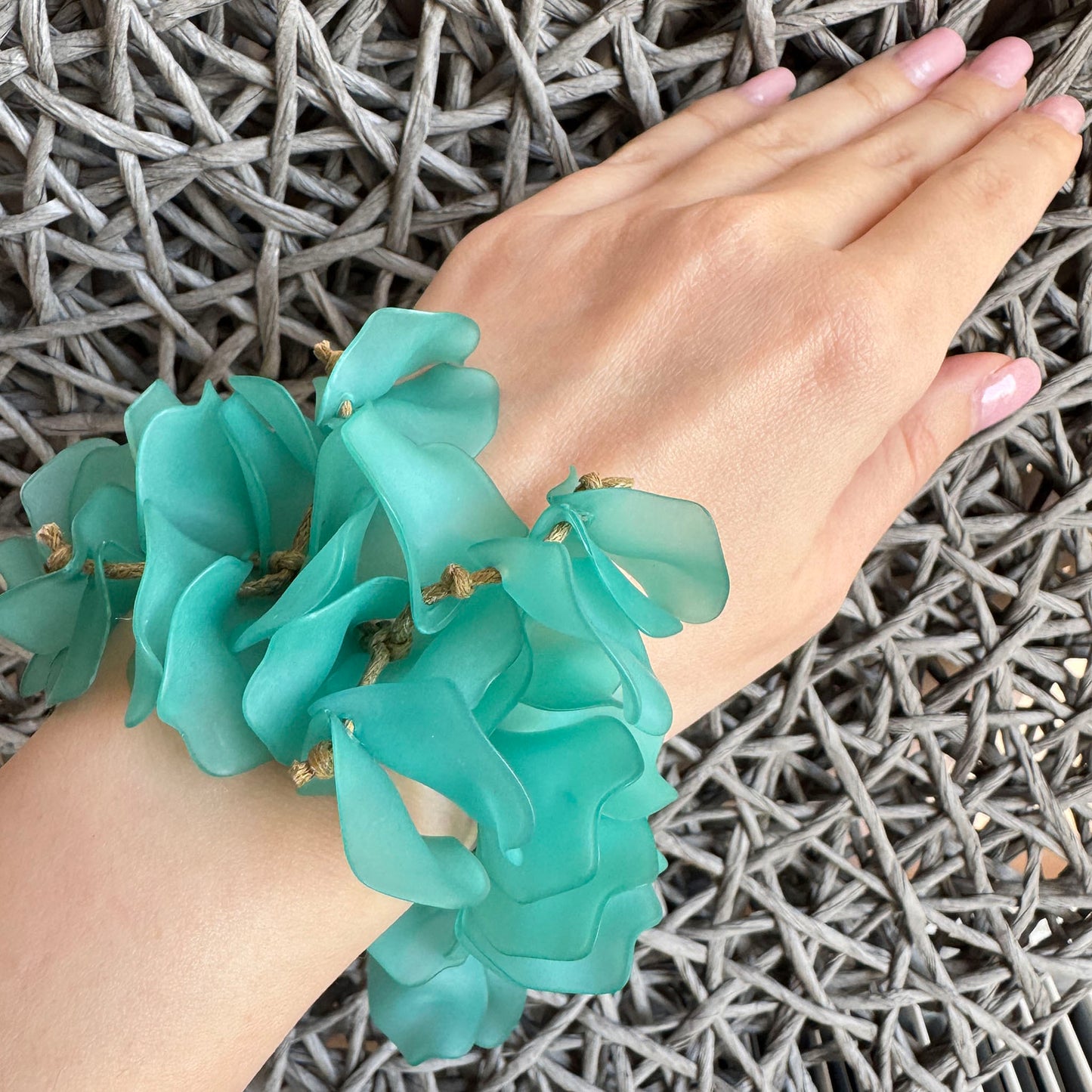 Turquoise petal bracelet worn as a statement summer fashion accessory