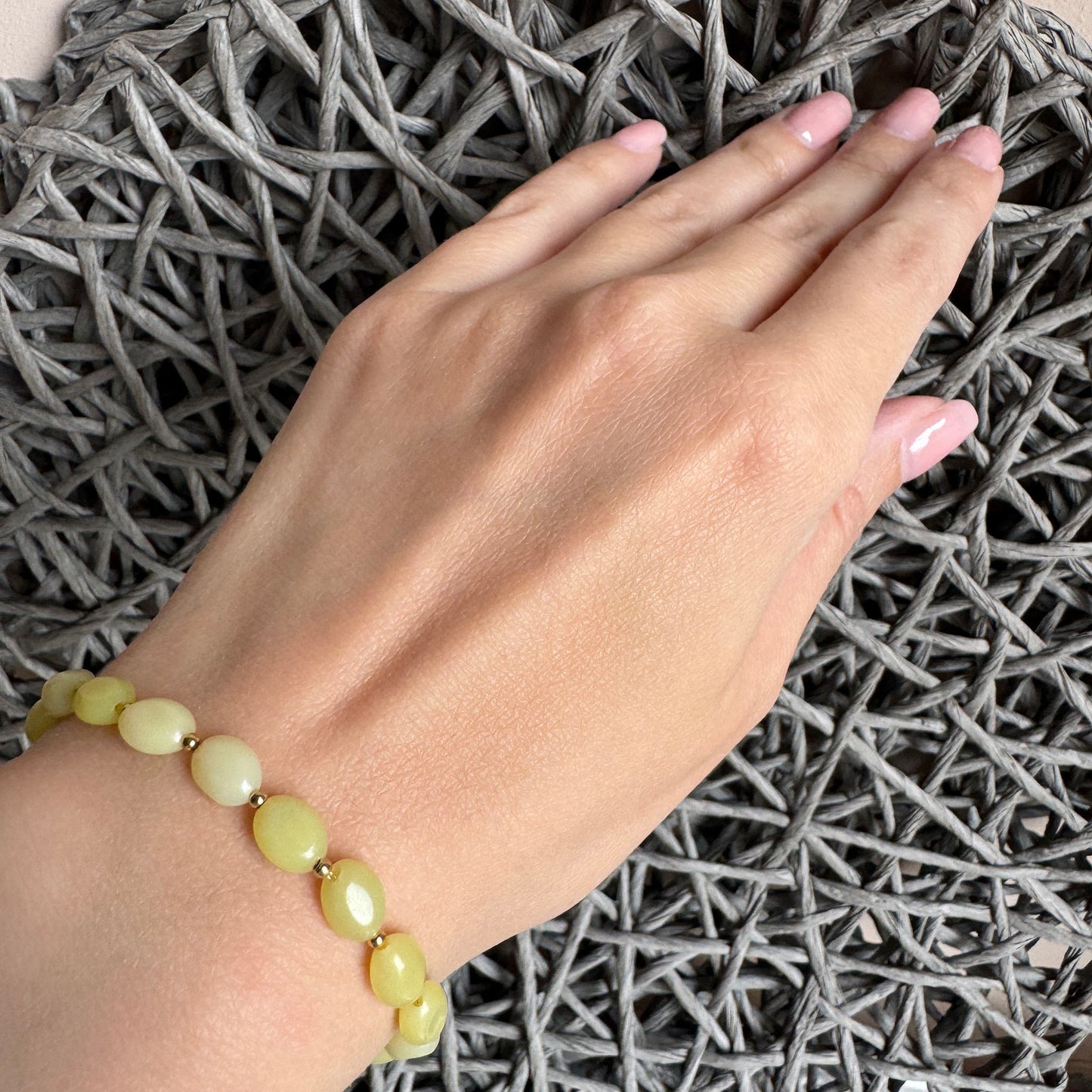 Yellow jade bracelet with glossy gold toggle clasp, perfect for summer by French brand Ikita.