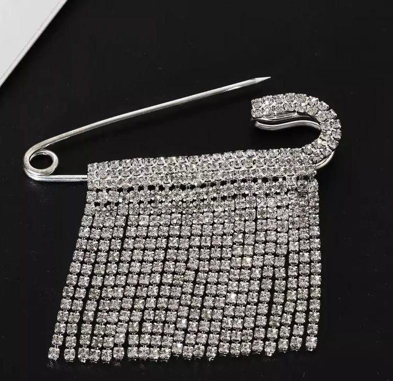 Brooch with zircons in silver colour