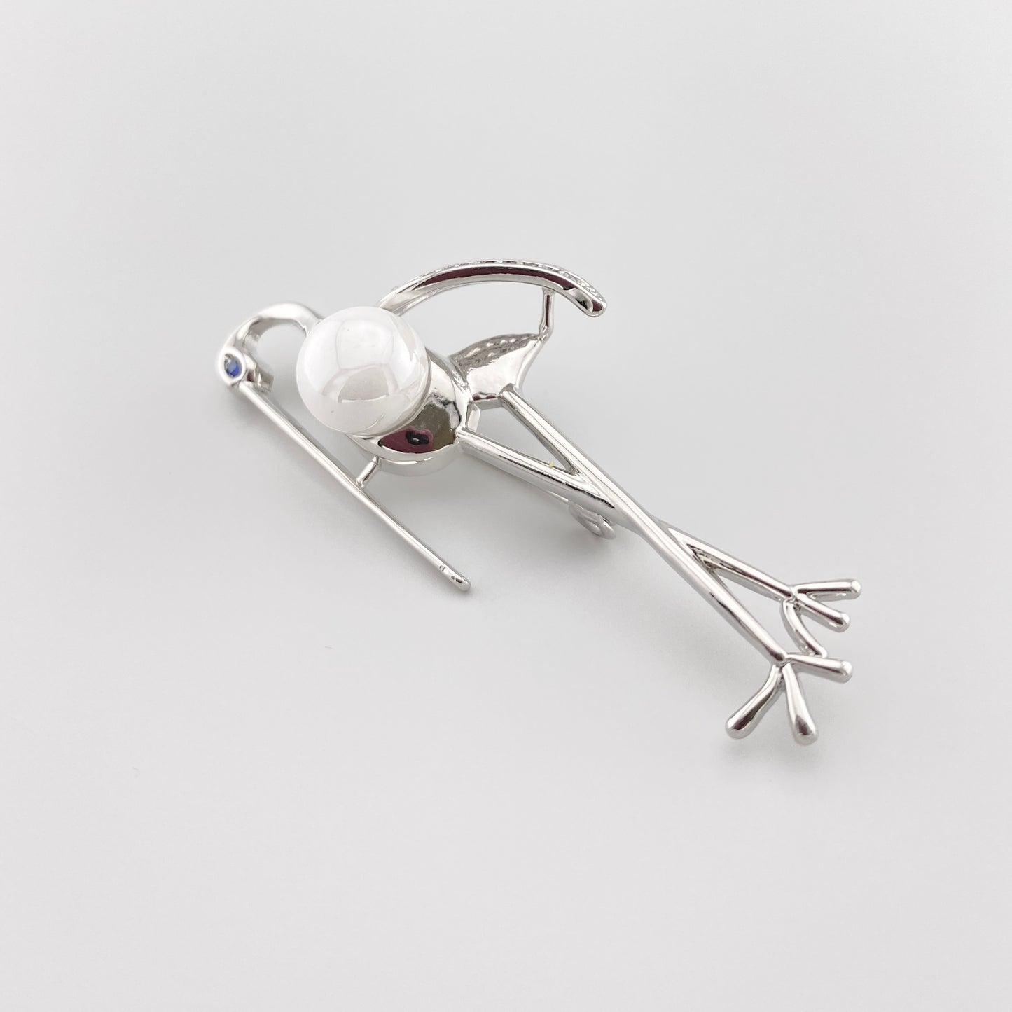 Stork brooch