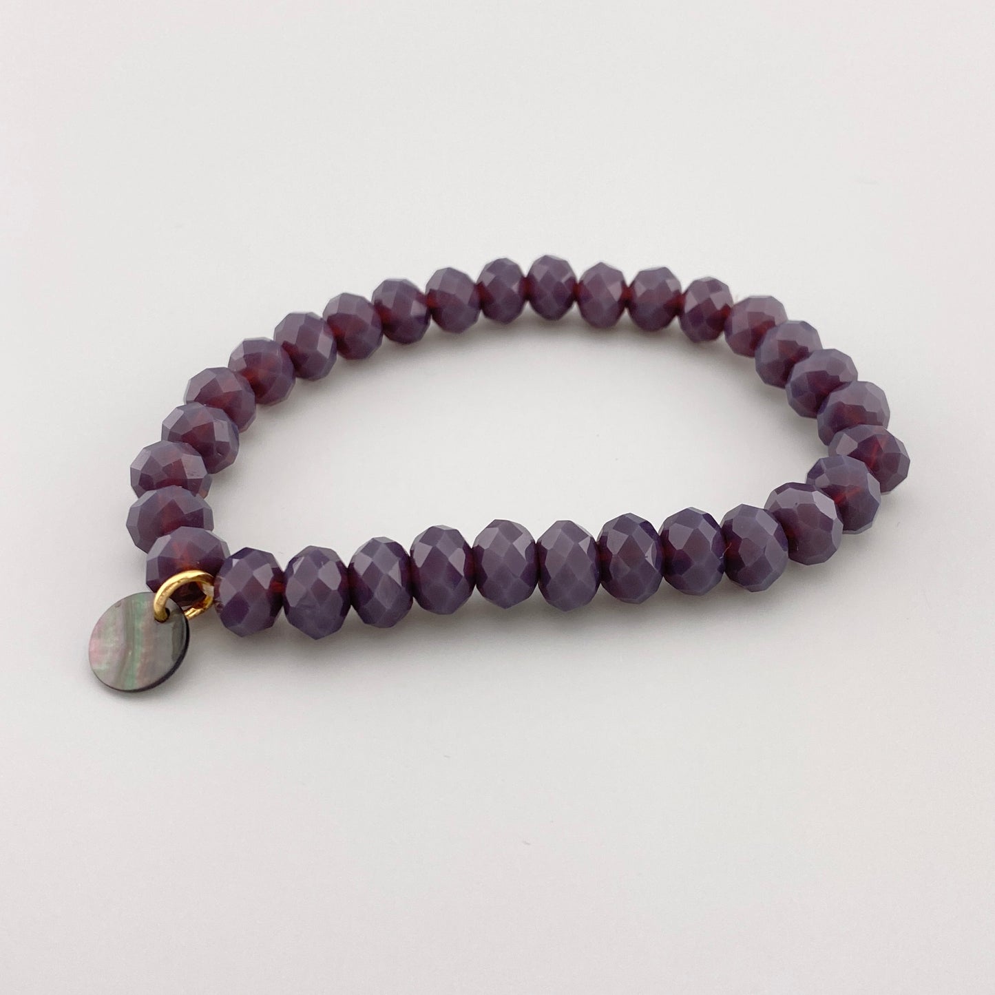 Pulsera elástica de cristales morados con diseño brillante