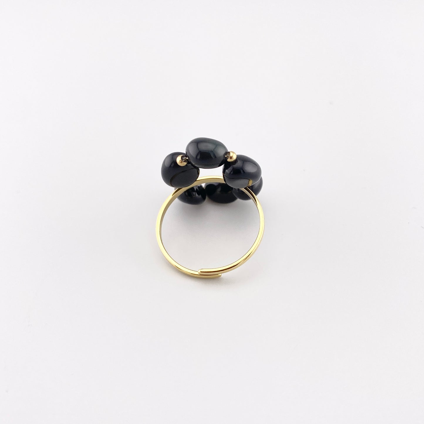 IRL ring with natural onyx displayed with branded pouch