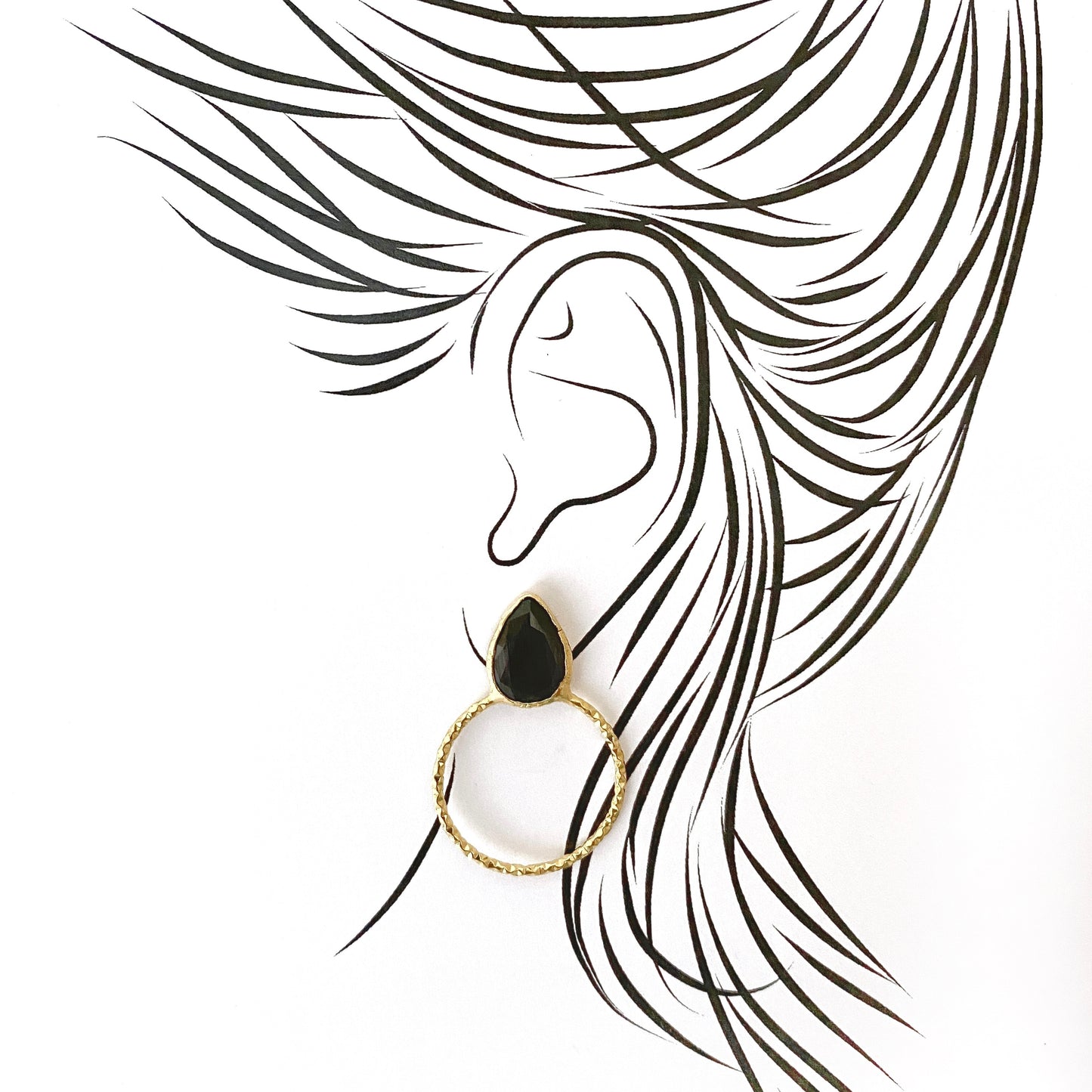 Elegant hoop earrings with black faceted stone and textured gold-plated frame