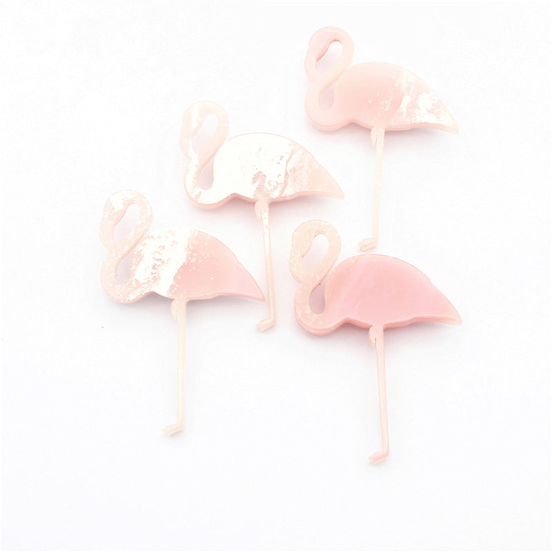 Conjunto de broches rosados en forma de flamencos