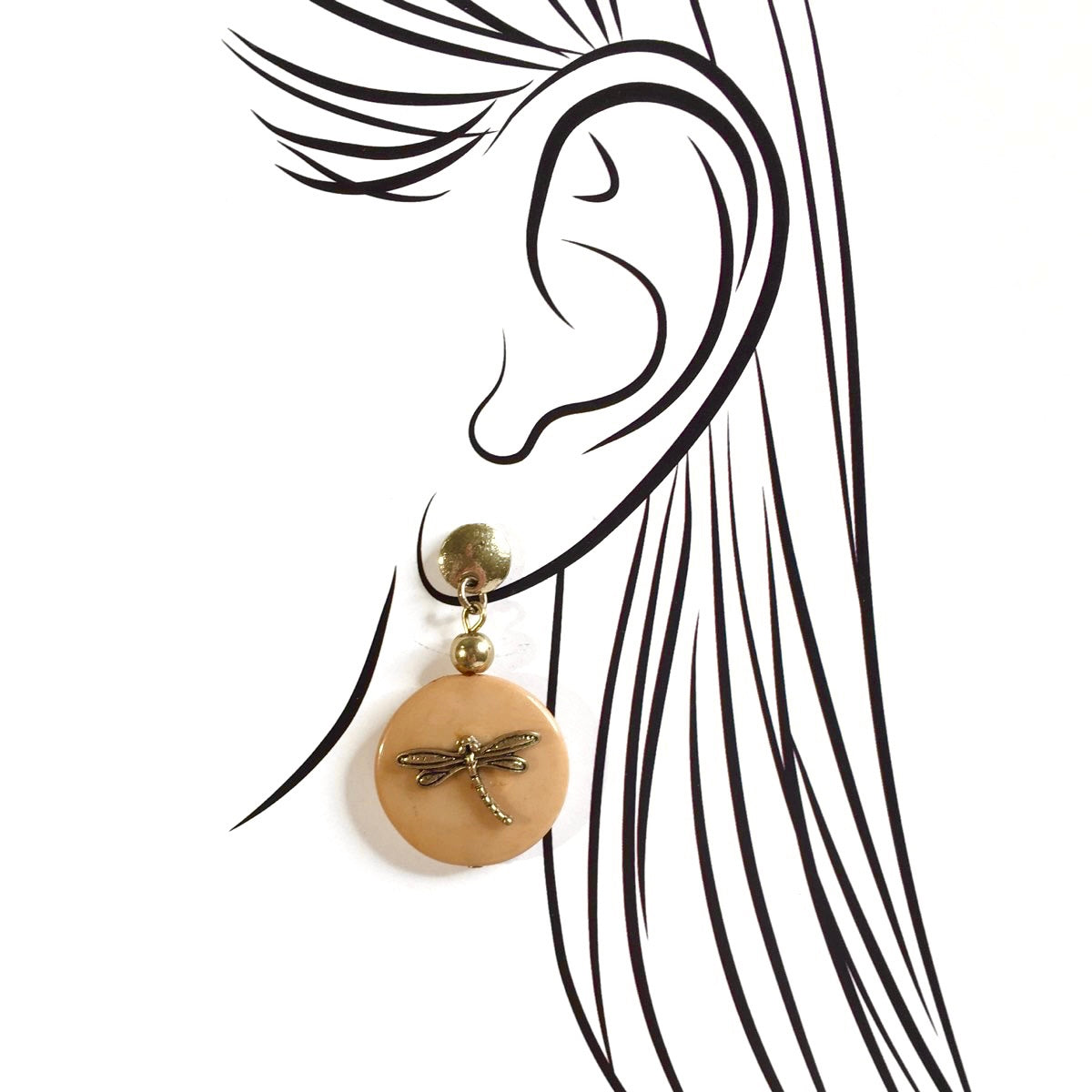 Caramel tone earrings with dragonfly motif on ear sketch