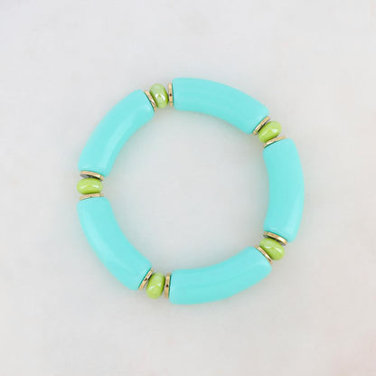 Elastisches Armband mit glänzenden türkisfarbenen und hellgrünen Perlen, französische Marke Ikita.