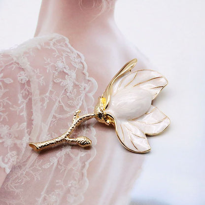 white flower brooch