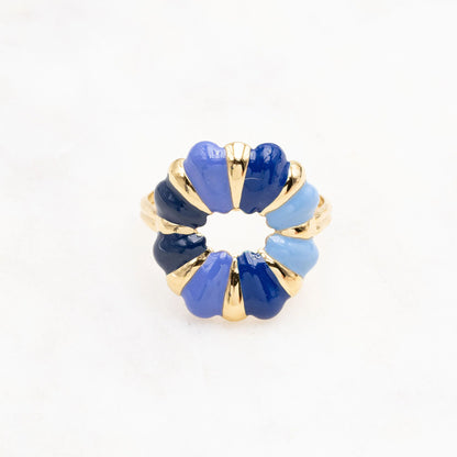 Gold-colored ring with enamel in various shades of blue.