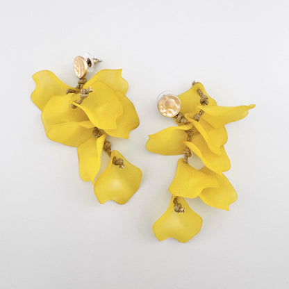 Dangling earrings with yellow flower petals and gold clasps.